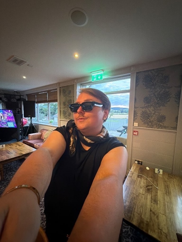 Guest posing in sunglasses